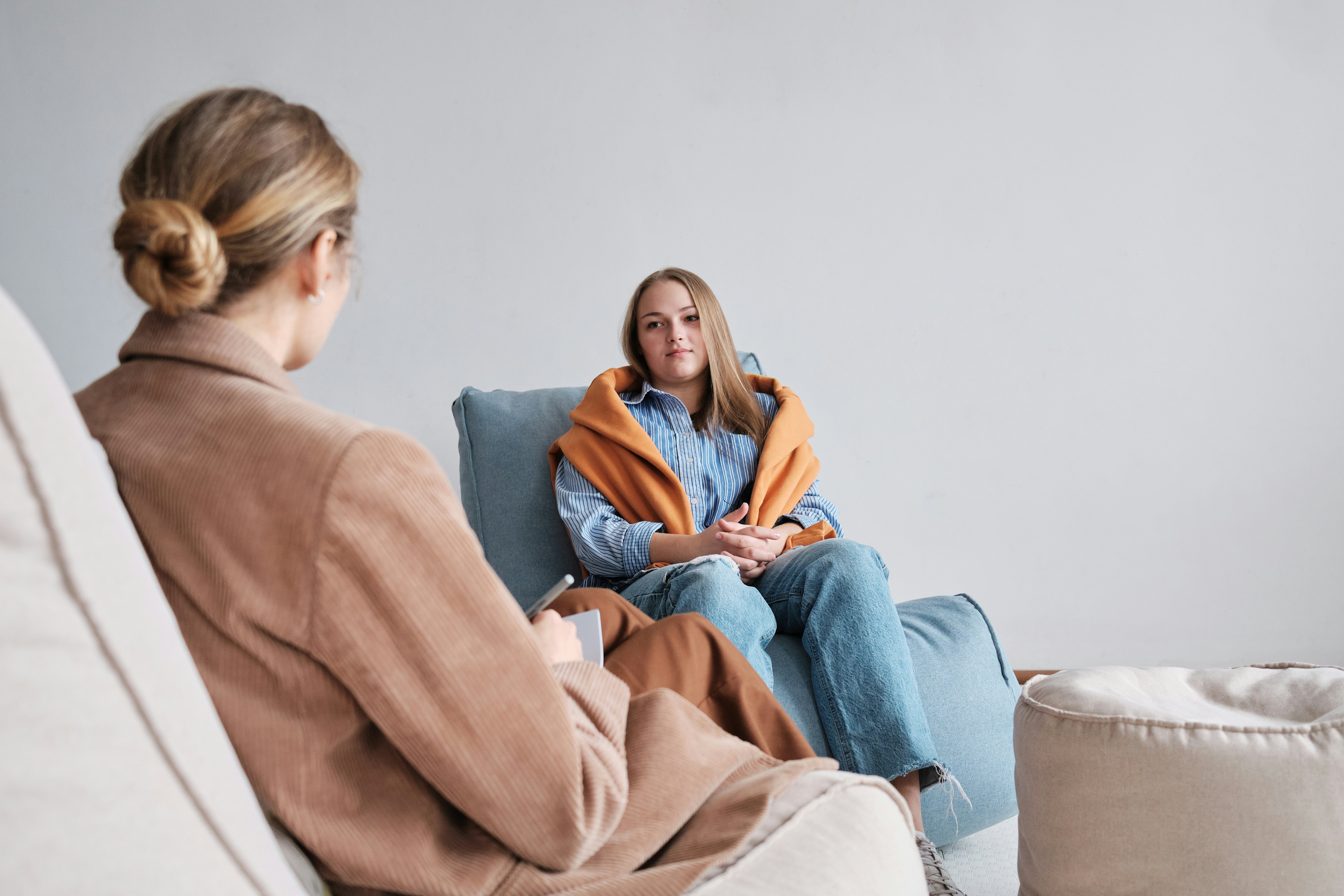 Therapist taking notes during a client session